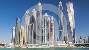 Scenic view of Dubai Marina Skyscrapers with boats timelapse, Skyline, View from sea, United Arab Emirates