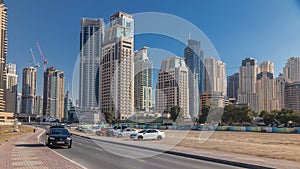 Scenic view of Dubai Marina Skyscrapers with cars timelapse, Skyline, View from sea, United Arab Emirates