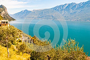 Scenic view from the edge of western coast of Garda lake on beautiful northern Italian nature surrounding this amazing lake. Rocky