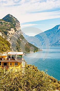 Scenic view from the edge of western coast of Garda lake on beautiful northern Italian nature surrounding this amazing lake. Rocky