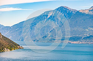 Scenic view from the edge of western coast of Garda lake on beautiful northern Italian nature surrounding this amazing lake. Rocky