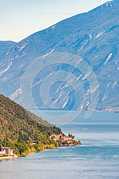 Scenic view from the edge of western coast of Garda lake on beautiful northern Italian nature surrounding this amazing lake. Rocky