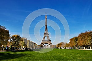 Scenic view of the Eiffel tower over blue sky