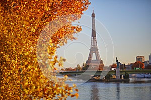 Scenic view of the Eiffel tower over the river Seine from Mirabeau bridge on a bright fall day in Paris