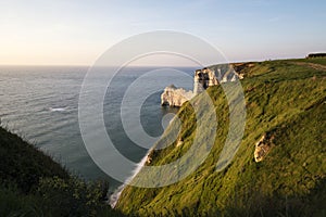 Scenic view of Etretat with its beach and famous cliffs with arc