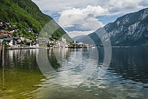 Scenic view of famous Hallstatt lakeside town reflecting in Hallstattersee lake in the Austrian Alps. Salzkammergut