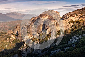 Scenic view of the famous Meteora floating monasteries on steep cliffs in Greece at sunrise. A journey to the wonders of