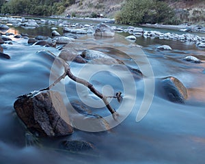 Scenic view of the flow of a river with trees alongside