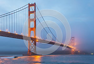 Scenic view of Golden gate in the in the dusk with lighting and reflection on the water and fog,San Francisco,California,usa