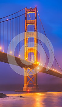 Scenic view of Golden gate in the in the dusk with lighting and reflection on the water and fog,San Francisco,California,usa