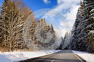 Scenic view of a highway in the Bavarian Alps with pine forest in winter