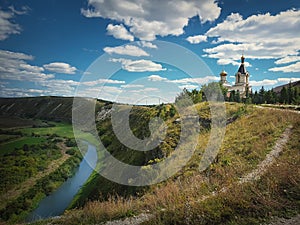 Scenic view from the hills to the Raut river at Orheiul Vechi The old city of Orhei. Christian monastery on top of the cliff at