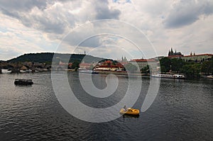 Scenic view of historical center of Prague, Charles Bridge and Vltava river, Saint Vitus Cathedral at cloudy summer day