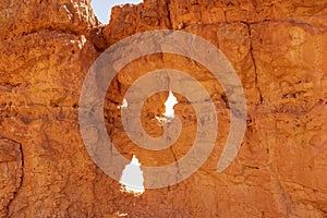 Scenic view on holes in pinnacle rock looking like a face on Peekaboo hiking trail, Bryce Canyon National Park, Utah, USA