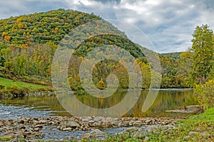 scenic view Housatonic River in Fall with colors on mountain