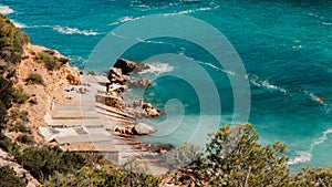 Scenic view of Ibiza beach with fishermen's huts in Ibiza, Beach Cala D'en Serra, Spain