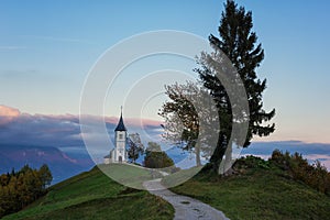 Scenic view of Jamnik church St Primus and Felician at sunset, Alps mountains, Slovenia. Beautiful landscape