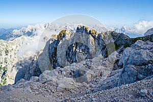 Scenic view in the Julian Alps, Slovenia, as seen from the hiking route down from Mangart peak, in Summertime, with clear sky.