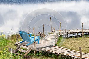 Scenic view landscape of blue chair and lake with a nature background