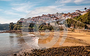 Scenic view of the Lastres sandy shore in Asturies, Spain photo