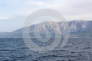 Scenic view of Makarska Riviera with untamed mountain range Biokovo Dinaric Alps. Majestic coastline of Adriatic Mediterranean Sea