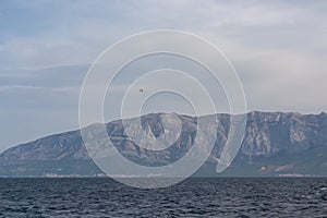 Scenic view of Makarska Riviera with untamed mountain range Biokovo Dinaric Alps. Majestic coastline of Adriatic Mediterranean Sea