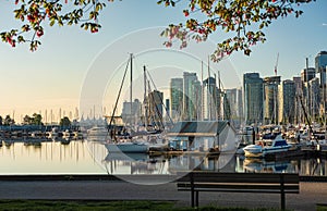 Scenic view on the Marina in Coal Harbour with boats parked in the water. Downtown Vancouver Canada in a summer morning
