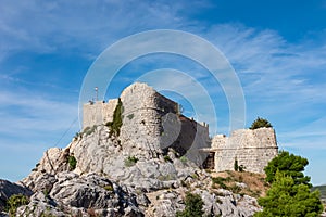 Scenic view of medieval fortress Starigrad in Omis, Split-Dalmatia, Croatia, Europe. Idyllic hiking trail along rugged landscape