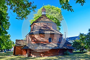Scenic view of medieval Greek Catholic wooden church of St. Paraskevi, Busk, Lviv region, Ukraine photo