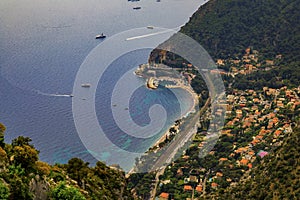 Scenic view of the Mediterranean coastline, the Alpes and medieval houses from Eze village, French Riviera, France