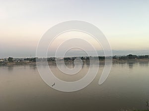 Scenic view of Mekhong River with a little boat in Nong Khai, Thailand