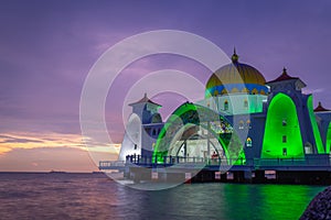 Scenic view of Melaka Straits Mosque in Malaysia on bright sunset sky background