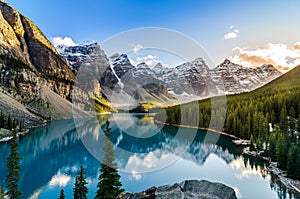 Scenic view of Moraine lake and mountain range at sunset