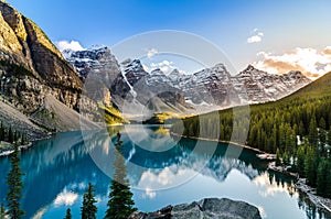 Scenic view of Moraine lake and mountain range at sunset photo
