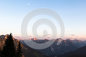 Scenic View of Mountain Panorama with Alpenglow in the Evening