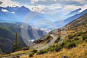 Scenic view of a mountain valley, summer in the Altai. Dangerous road over the gorge