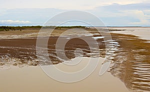 Scenic view of Mudflats at Derby Wharf, Western Australia on a cloudy afternoon