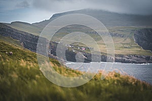 Scenic view of Mykines on a cloudy day in Faroe Islands