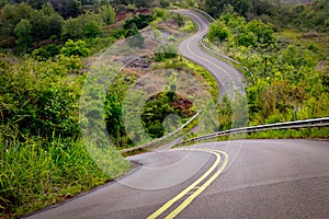 Scenic view of narrow curvy road and rural landscape, Kauai, Hawaii