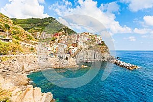 Scenic view of ocean and harbor in colorful village Vernazza, Ci