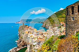 Scenic view of ocean and harbor in colorful village Vernazza, Ci