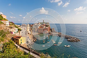 Scenic view of ocean and harbor in colorful village Vernazza, Ci