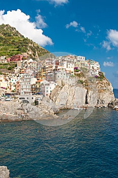 Scenic view of ocean and harbor in colorful village Vernazza, Ci