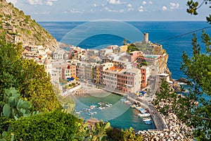Scenic view of ocean and harbor in colorful village Vernazza, Ci