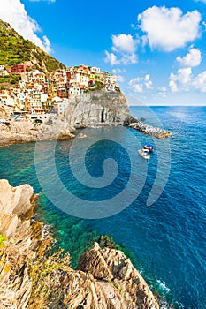 Scenic view of ocean and harbor in colorful village Vernazza, Ci