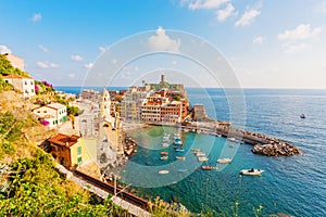 Scenic view of ocean and harbor in colorful village Vernazza, Ci