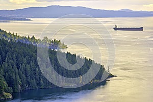 Scenic view of the ocean and shoreline at sunset in Maple Bay, Vancouver Island, BC