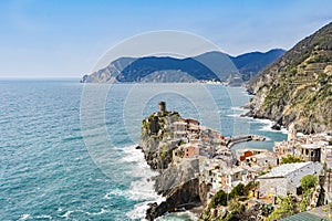 Scenic view of ocean and Vernazza village located in Cinque Terre, Italy