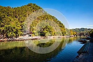 Scenic view of the old houses reflected in water of the Tuojiang River Tuo Jiang River in Phoenix Ancient Town