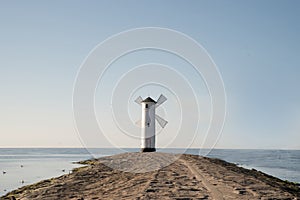 Scenic view of the old mill lighthouse at sunrise. Swinoujscie. Poland.lighthouse mill